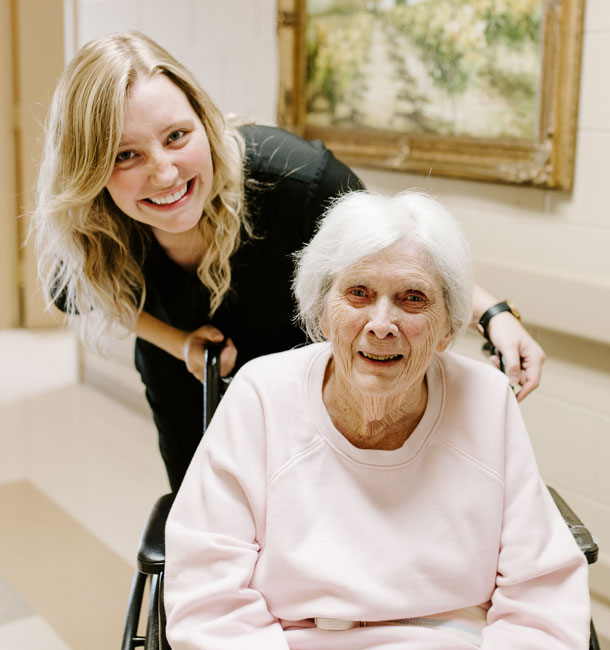 Staff Member with Elder at Ash Flat Healthcare and Rehab Center